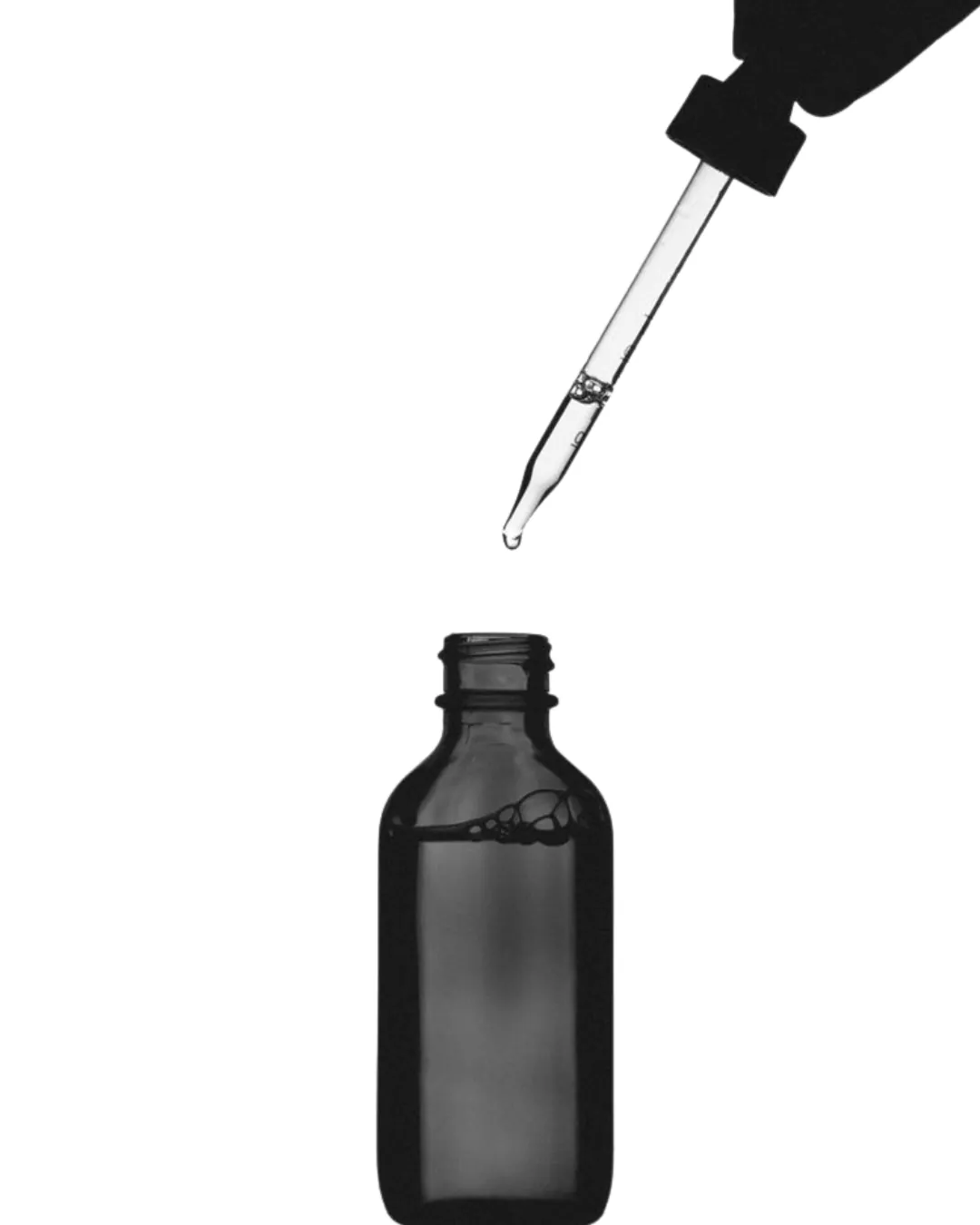 A dropper above a serum bottle, product development for a skincare brand